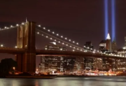 The World Trade Center Tribute in Lights with the Brooklyn Bridge in the foreground.