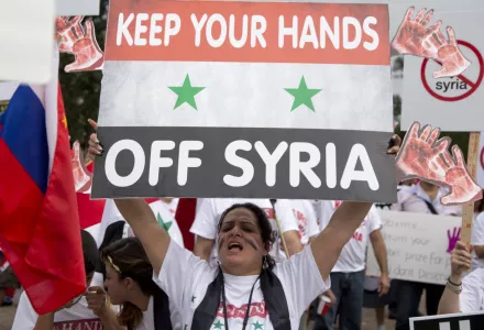 Protesters against U.S. military action in Syria shout during a demonstration in front of the White House in Washington, September 9, 2013.