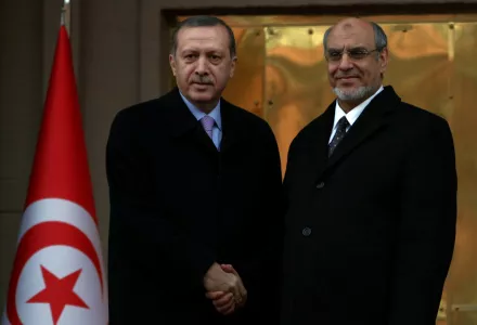 Turkish Prime Minister Recep Tayyip Erdogan, left, and his Tunisian counterpart Hamadi Jebali shake hands as they pose for cameras before a meeting in Ankara, Turkey, Tuesday, Dec. 25, 2012.