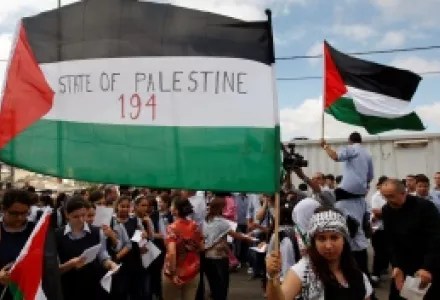 Palestinians march during a rally to support the Palestinian statehood bid in the United Nations, in the West Bank city of Ramallah.