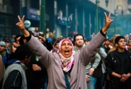 A woman protester flashes the victory sign after clashes with military police near Cairo's Tahrir Square.