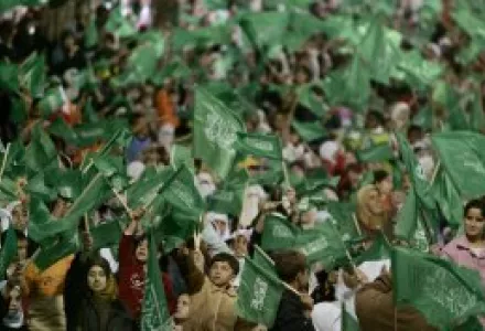 Hamas supporters wave flags during a rally in the southern West Bank city of Hebron, Friday Oct. 27, 2006.