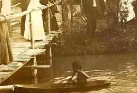 Little Moro "paddling his own canoe," Arrowhead Lake, Louisiana Purchase Exposition, St. Louis, Missouri, 1904.
