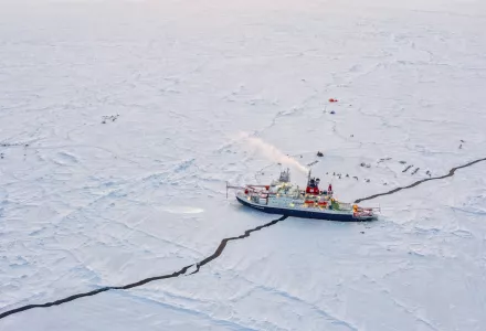 A lead in the Arctic Ocean sea ice runs beneath the icebreaker Polarstern.