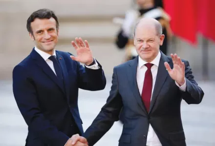 French President Emmanuel Macron welcomes German Chancellor Olaf Scholz to a summit of EU leaders at the Palace of Versailles on March 10, 2022.