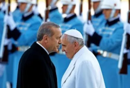 Turkey's President Recep Tayyip Erdogan and Pope Francis review an honor guard during an official visit in Ankara, Turkey.
