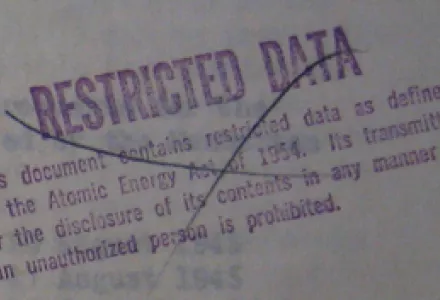 A canceled Cold War classification stamp designating a document as containing nuclear weapons related 'Restricted Data'."