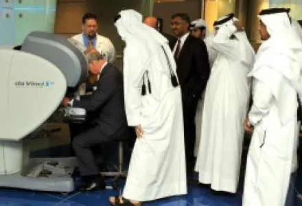 Qatari doctors examine a 3D microscope designed for micro-robotic heart surgery at the Doha Science and Technology Park.