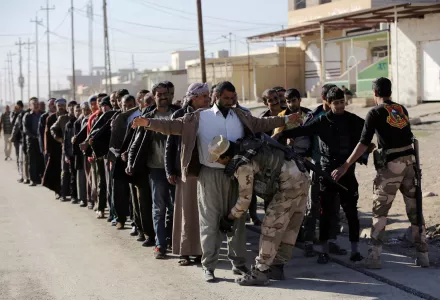 Iraqi soldiers searched scores of Iraqi male residents who were rounded up in Mosul's Gogjali neighborhood on Thursday, Nov. 24, 2016. Iraqi forces urged them to come out with information of any Islamic State members among them. An Iraqi officer addressed the group, demanding to know the whereabouts of alleged IS militants who opened fire on troops a few days earlier.