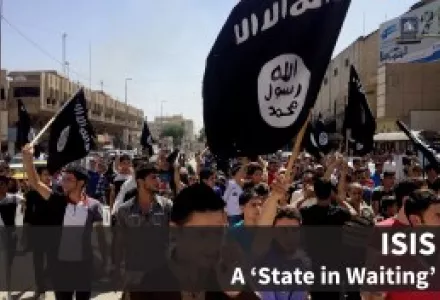 Demonstrators chant slogans to support al-Qaida-inspired Islamic State of Iraq and the Levant as they carry al-Qaida flags in front of the provincial government headquarters in Mosul, Iraq.
