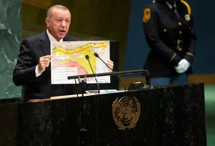Turkey's President Recep Tayyip Erdogan holds up a chart while addressing the 74th session of the United Nations General Assembly, Tuesday, Sept. 24, 2019.