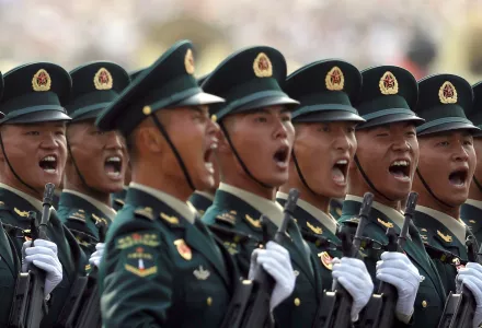 Members of China's People's Liberation Army (PLA) Rocket Force let out a yell as they march in formation during a parade to commemorate the 70th anniversary of the founding of Communist China in Beijing, Tuesday, Oct. 1, 2019. (AP Photo/Mark Schiefelbein)
