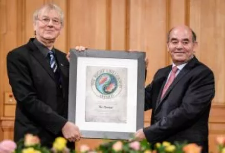 Raji Sourani from Palestine, right, receives the Right Livelihood Award from the founder of the award, Jakob von Uexkull, during a ceremony at the Swedish Parliament in Stockholm, Sweden, Monday Dec. 2, 2013.