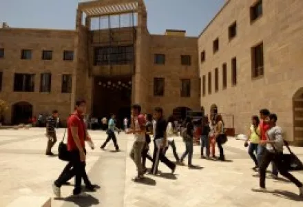 In this Monday, May 9, 2011 photo, students walk through the American University in Cairo campus in New Cairo, Egypt.