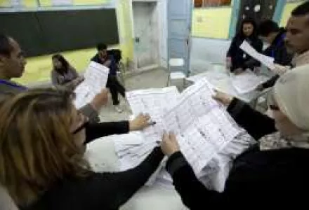 National observers and officials count votes at a polling station in Tunis, Tunisia.