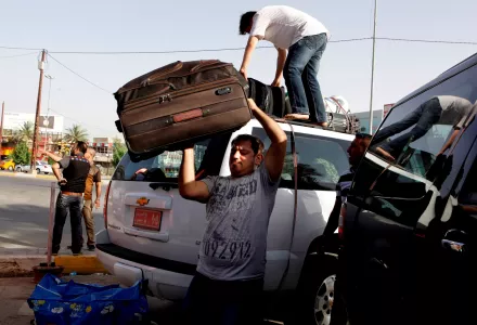 Syrian refugees leave Iraq to Syria to reunite with their families at a bus station in Baghdad, Iraq, Tuesday, June 11, 2013. 