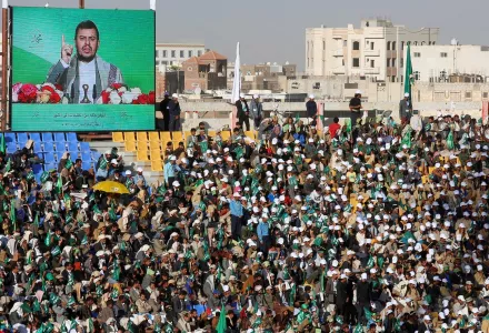 Yemenis supporters of the Ansarallah movement (the Houthis) listen to a speech by Abdul-Malik al-Houthi on a screen during moulid al-nabi celebrations, the birth of Islam's Prophet Muhammad in Sanaa, Yemen (AP Photo/Hani Mohammed