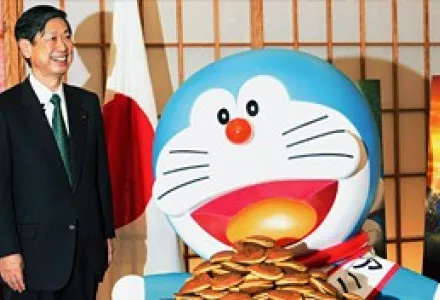 Japan's popular comic book character, Doraemon, is presented with dorayaki by Japanese Foreign Minister Masahiko Komura after Komura named Doraemon Japan's first Anime Ambassador on March 19, 2008. Doraemon will promote Japan's pop culture to the world.
