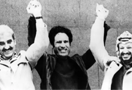 Palestine Liberation Organization Chairman Yasser Arafat, right, raises his hands with Libya's Col. Moammar Gadhafi, center, & Popular Front for the Liberation of Palestine leader George Habash, at the Arab Nations Summit, Tripoli, Libya, Dec. 4, 1977