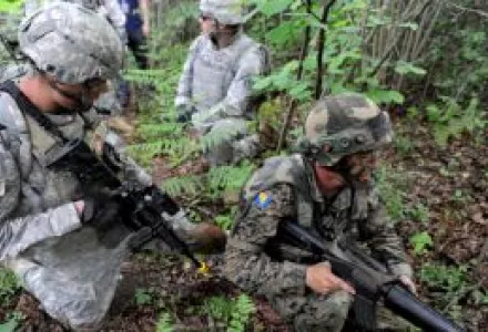 Pvt. Jacob Pharr, a radio operator with U.S. Army Europe's 1st Squadron, 2nd Cavalry Regiment, and his Bosnian-Herzegovinian partner pull security while on an ambush Situational Training Exercise held at the Slunj Training Area 1 June 2012.