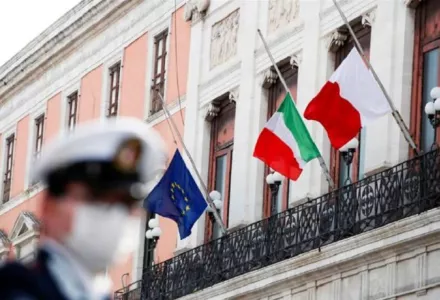 The flags of Italy, the European Union and Bari flutter at half-mast to honour Italy's dead due to coronavirus in the city of Bari, a southern port city that has been badly hit by the coronavirus pandemic