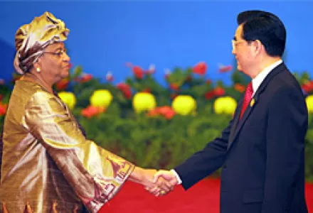 Chinese President Hu Jintao, right, shakes hands with Liberian President Ellen Johnson Sirleaf during the welcoming ceremony for the Beijing Summit of the Forum on China-Africa Cooperation held in Beijing, China,  Nov. 4, 2006.