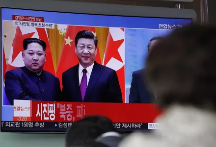 People watch a news program on TV reporting about the meeting between North Korean leader Kim Jong Un and Chinese President Xi Jinping at the Seoul Railway Station in Seoul, South Korea, Wednesday, March 28, 2018.