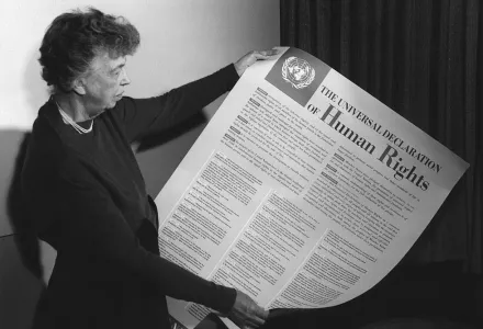 Eleanor Roosevelt holding poster of the Universal Declaration of Human Rights (in English), Lake Success, New York. November 1949.