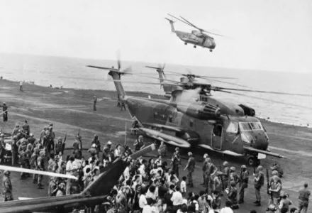 Evacuees from the DAO Compound are offloaded onto the U.S. Navy aircraft carrier USS Midway (CVA-41) during the evacuation of South Vietnam ("Operation Frequent Wind"), April 29, 1975