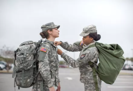 Female soldier's doing a uniform check  