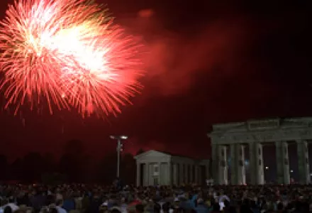 A shower of fireworks burns the sky over the Brandenburg Gate into shades of red when hundreds of thousands of spectators watched the German unification ceremony early October 3, 1990.