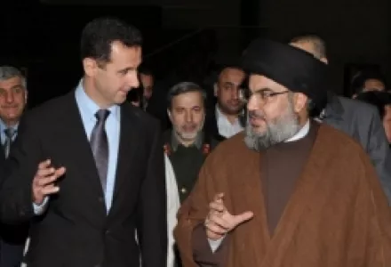 Hezbollah leader sheik Hassan Nasrallah, right, speaks with Syrian President Bashar Asad, left, upon their arrival for a dinner, in Damascus, Syria, Feb. 25, 2010.