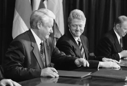 Russian President Borys Yeltsin and U.S. President Bill Clinton bump elbows after the signature of the Budapest Memorandum on security assurances to Ukraine in connection with its accession to the NPT on December 6, 1994 with Ukraine’s President Leonid Kuchma (far right), and British Prime Minister John Major (not in the photo).