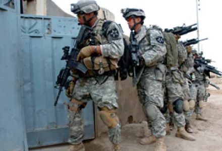 Soldiers of 5th Battalion, 20th Infantry Regiment, 3rd Stryker Brigade Combat Team, prepare to enter a building in Baqouba, Iraq, Mar. 15, 2007. The regiment was moved to Diyala province to reinforce troops there to try to quell ongoing violence.