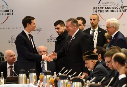 White House Senior Adviser Jared Kushner (L) shakes hands with US Secretary of State Mike Pompeo as they arrive for a session at the conference on Peace and Security in the Middle East in Warsaw