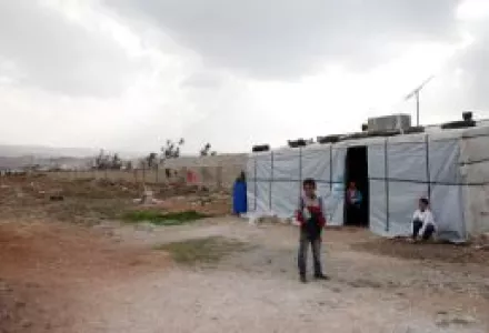 Syrian refugee children outside their temporary home in Lebanon's Bekaa Valley, 5 November 2013.