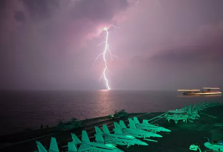 Lighting flashes as the aircraft carrier USS Abraham Lincoln (CVN 72) transits the Straight of Malacca.