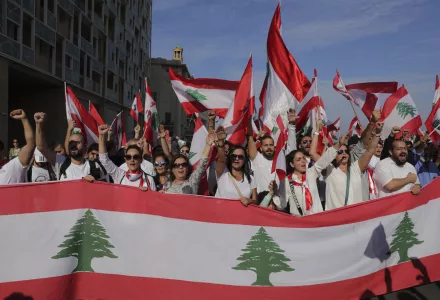Anti-government protesters shout slogans during separate civil parade at the Martyr square, in downtown Beirut, Lebanon, Friday, Nov. 22, 2019. Protesters gathered for alternative independence celebrations, converging by early afternoon on Martyrs’ Square in central Beirut, which used to be the traditional location of the official parade. Protesters have occupied the area, closing it off to traffic since mid-October.