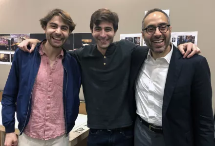 Daniel and Patrick Lazour stand with MEI Faculty Director Tarek Masoud behind the scenes of We Live in Cairo