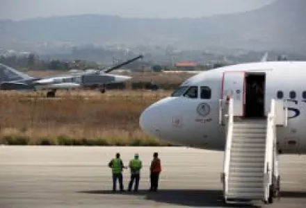 Russian Air Force Sukhoi Su-24 passes a Syrianair Airbus A320 at Latakia, Syria, October 3, 2015.