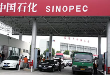 Cars are refueled at a Sinopec gas station in Jiangsu Province, China, Oct. 1, 2010. Sinopec bought 40 percent of Spanish oil giant Repsol's Brazilian subsidiary for $7.1 billion, heralding more Chinese expansion in Latin America.