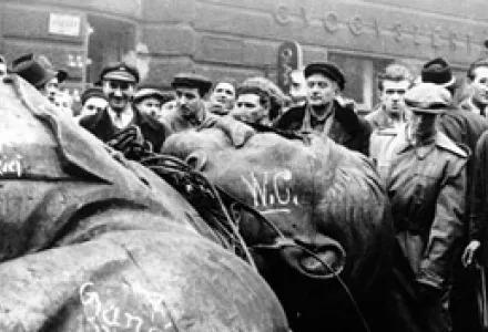 People gather around a fallen statue of Soviet leader Josef Stalin in front of the National Theater in Budapest, Hungary, Oct. 24, 1956.