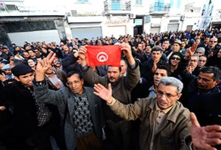 Hundreds of demonstrators chant slogans in Tunisia.