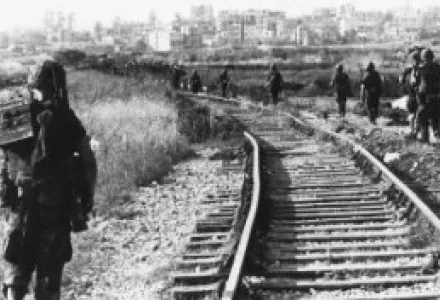Marines of Company C, BLT 1/8, 24th Marine Amphibious Unit, conduct a foot patrol along the railroad tracks southeast of the company positions in Lebanon in late August 1983.