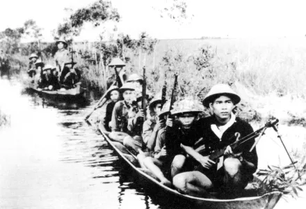 Viet Cong crossing a river in 1966