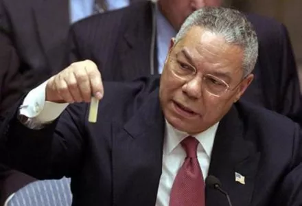 At the UN, Colin Powell holds a model vial of anthrax, while arguing that Iraq is likely to possess WMDs, 5 February 2003.