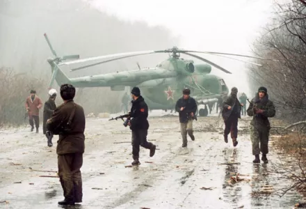 Chechen fighters near a downed Russian Mi-8 helicopter near the Chechen capital, Grozny, December 1994.