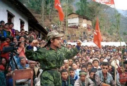 A Maoist rebel speaks to villagers in the area around Piskar, a mountain village about 200 kilometers east of the capital Kathmandu, during the Nepalese Civil War.
