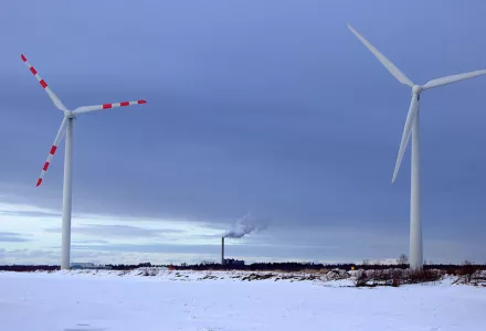 Wind turbines on Vihreäsaari island in Oulu, 4 April 2012. In 1990, Finland became the first European country to enact carbon taxes.