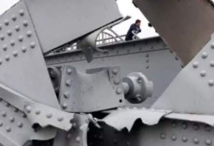 A Chinese man is framed by the remains of the Yalu River Broken Bridge which was bombed by U.S. forces during the Korean War near Dandong, China, Oct. 19, 2006. On Oct. 19, 1950, China sent hundreds of thousands of "volunteers" to the aid of North Korea.